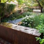 corten steel water table in garden